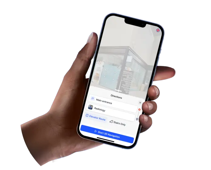 A hand holds a smartphone displaying a white-labeled Treedis app, showing a 3D view of an interior space and a directions menu with options like "Main entrance" and "Radiology."